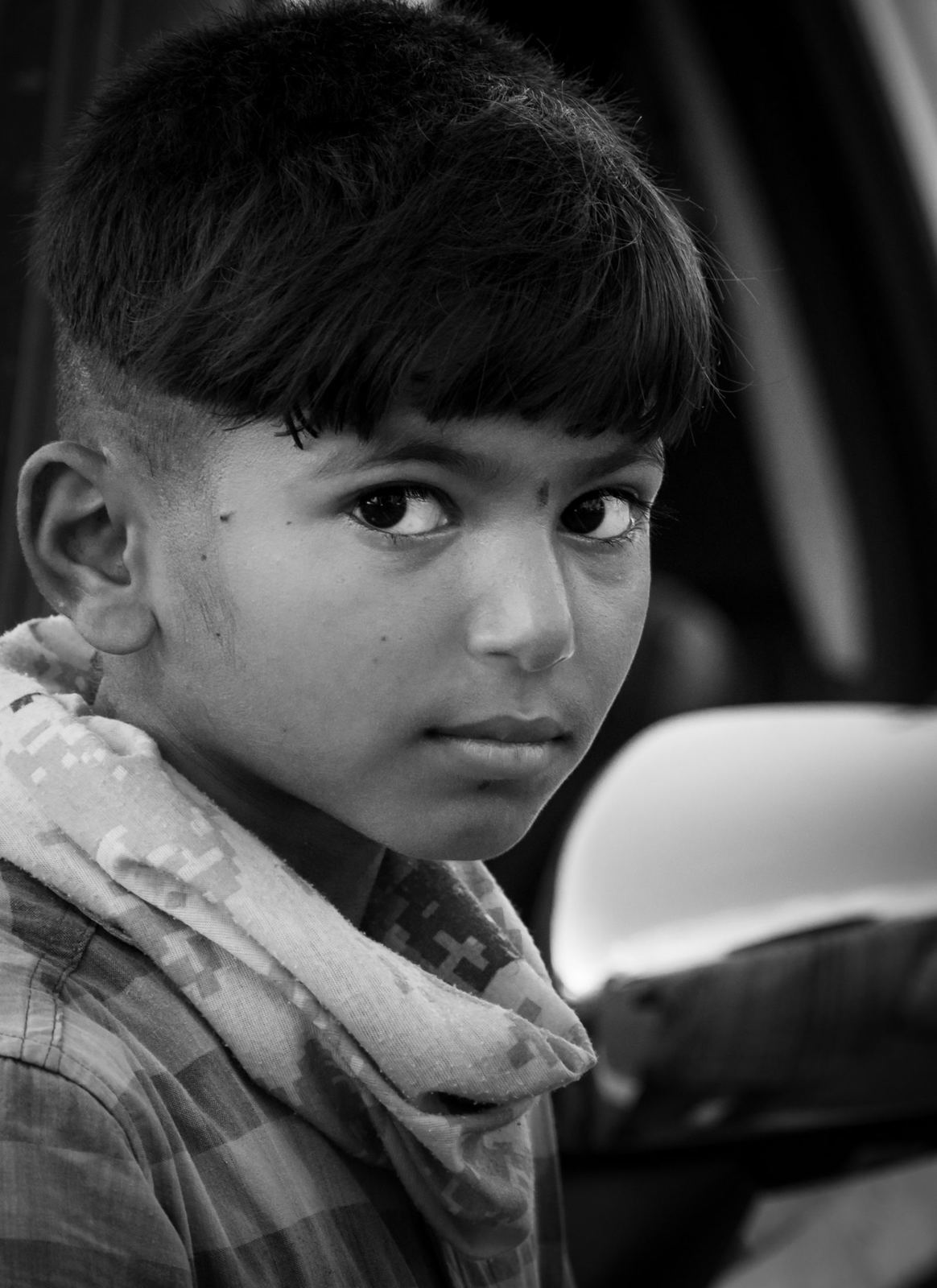 Young boy with a fresh cut, black and white portrait