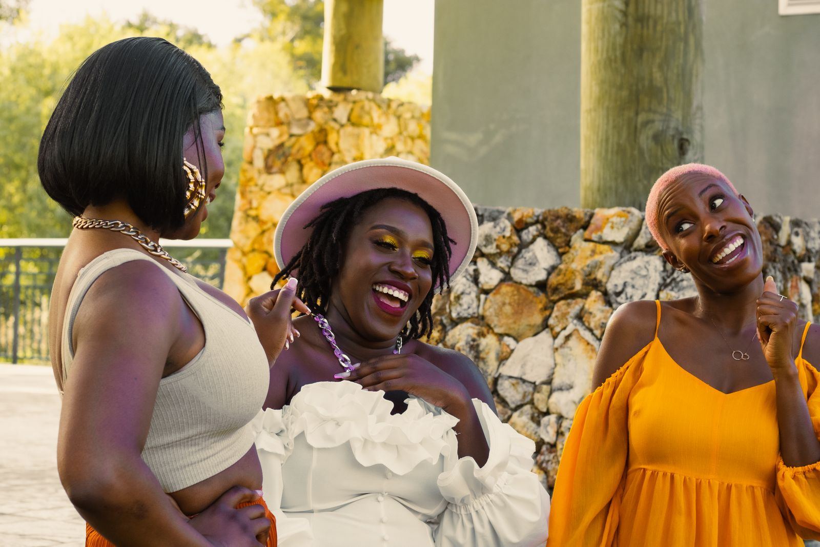 Friends with braids and natural styles laughing together
