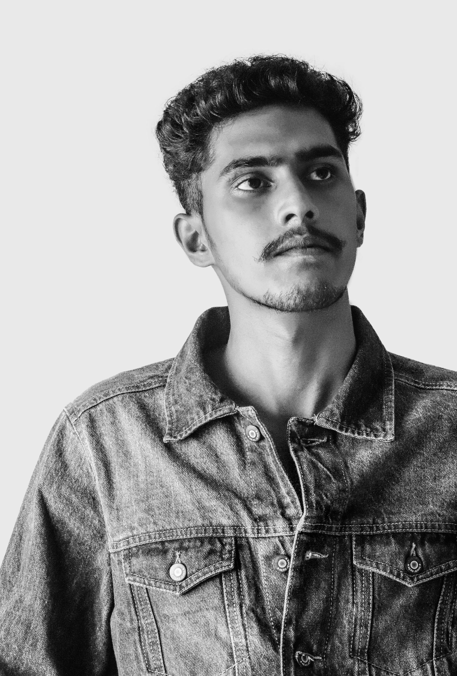 Black-and-white portrait of Samir Haddad with a groomed mustache