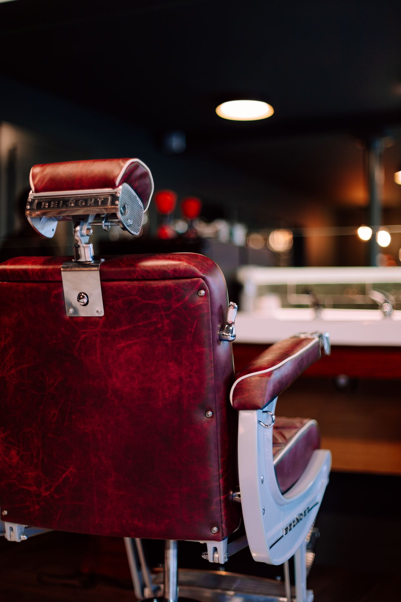 Oxblood leather barber chair with chrome headrest
