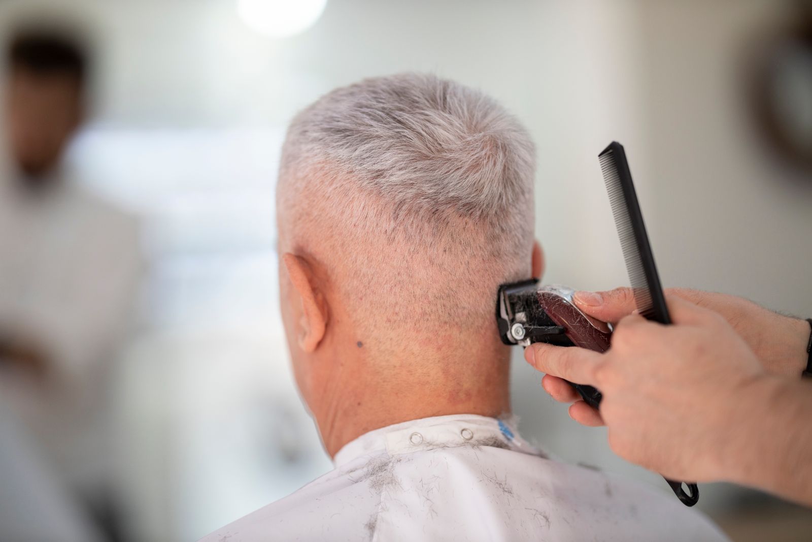 Clipper taper on a client with silver hair