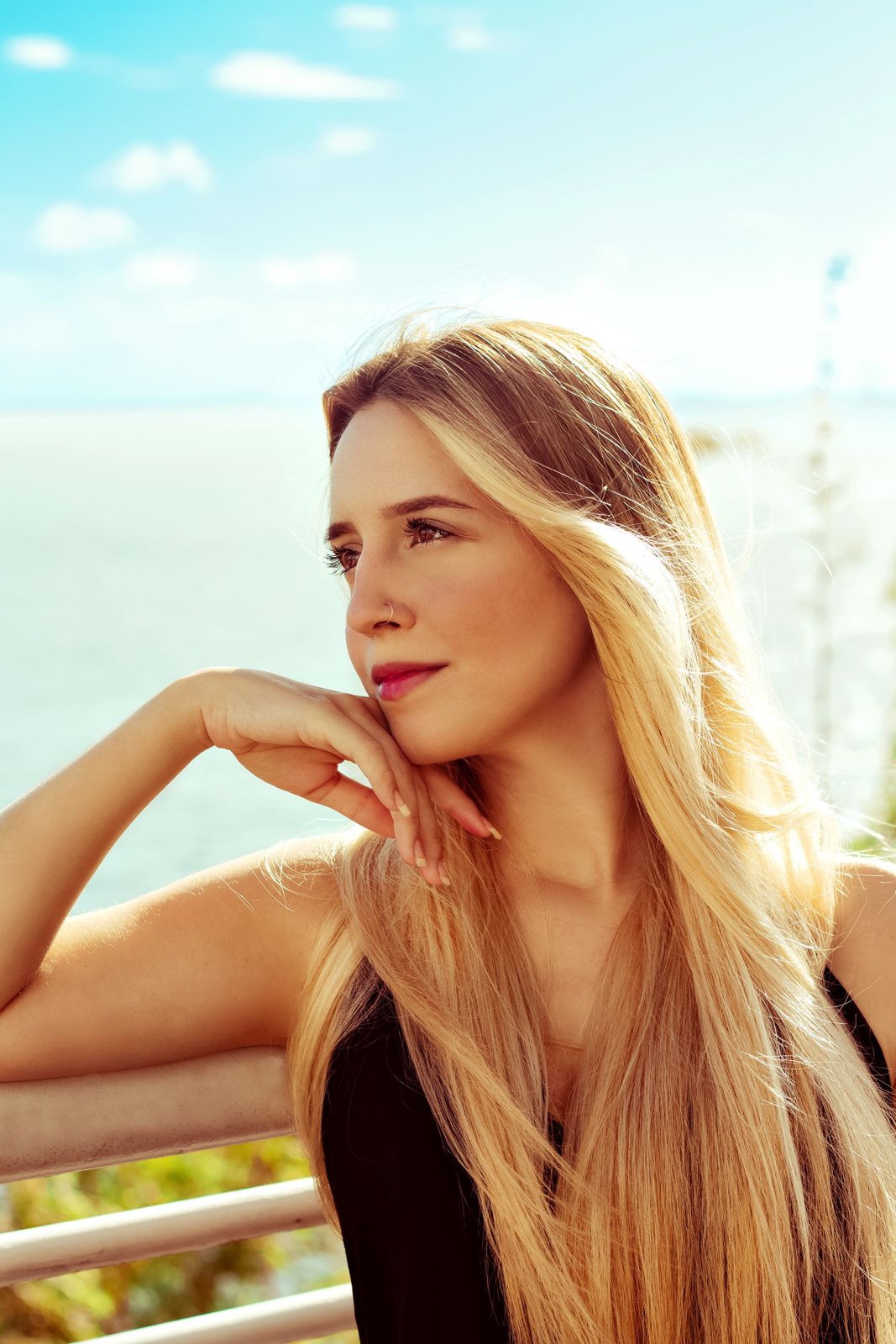 Sunny long blonde hair by the sea