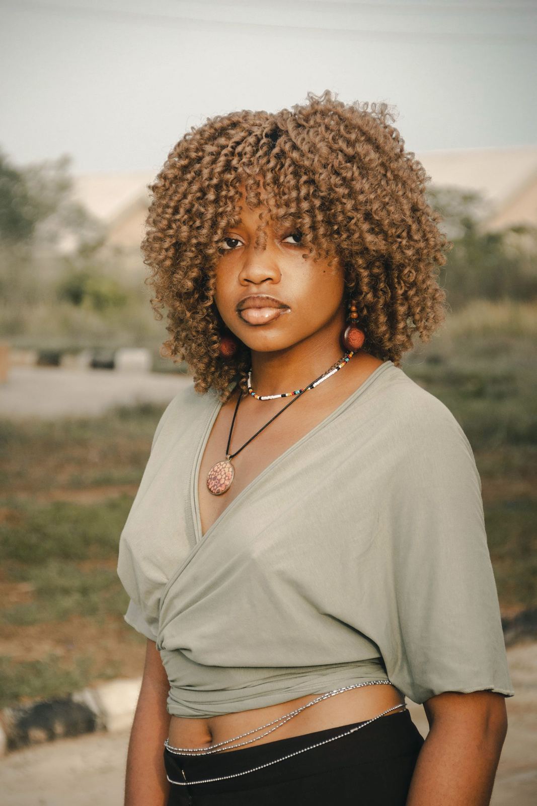 Marisol Reyes, curl specialist, smiling in golden light
