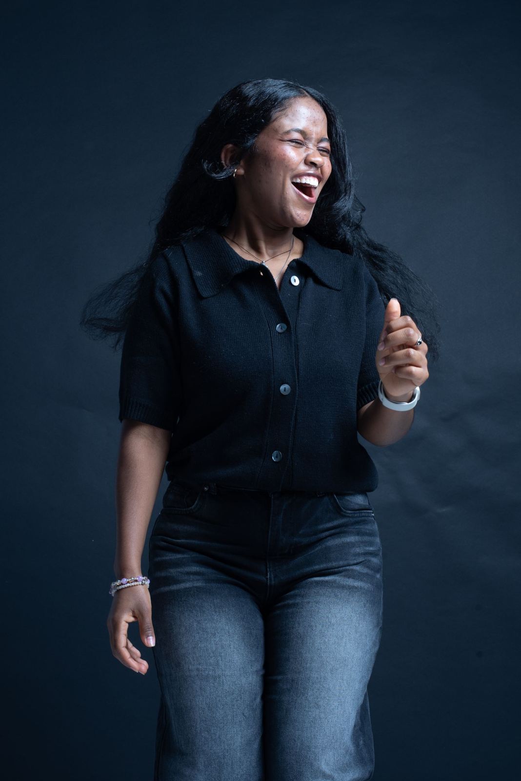 Simone Adeyemi, owner of Crown & Coil, laughing