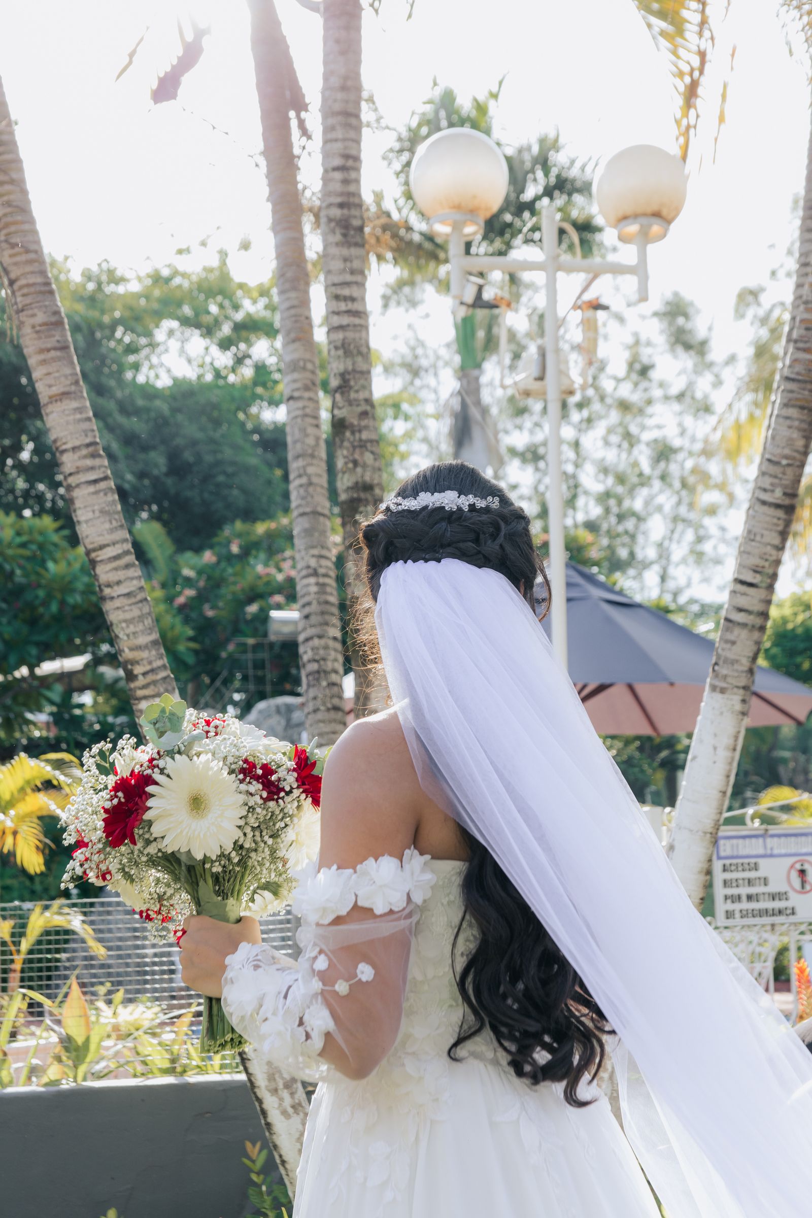 Bride with long curls and a flowing veil