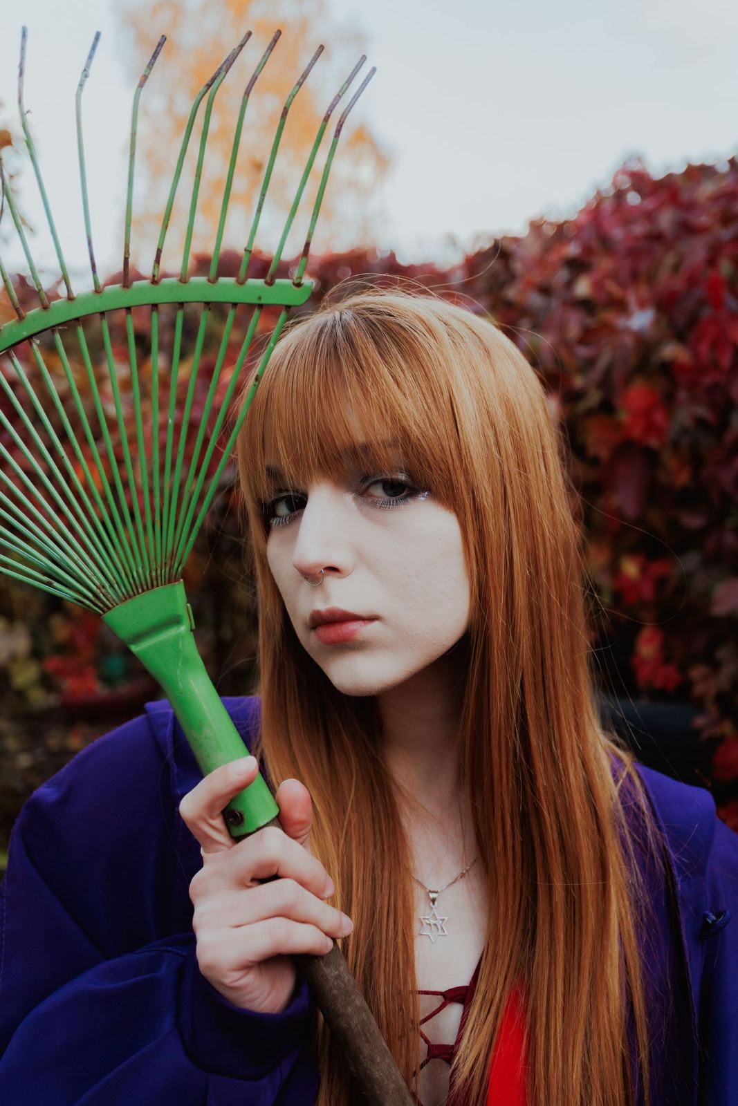 Strawberry-copper hair with full fringe