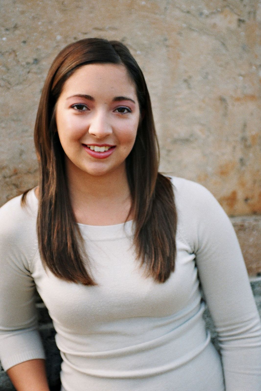 Smiling woman with sleek straight blowout