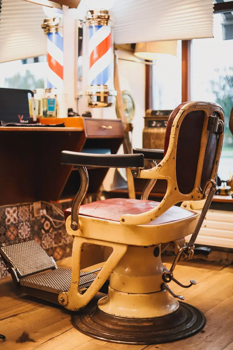Vintage barber chair glowing in warm light