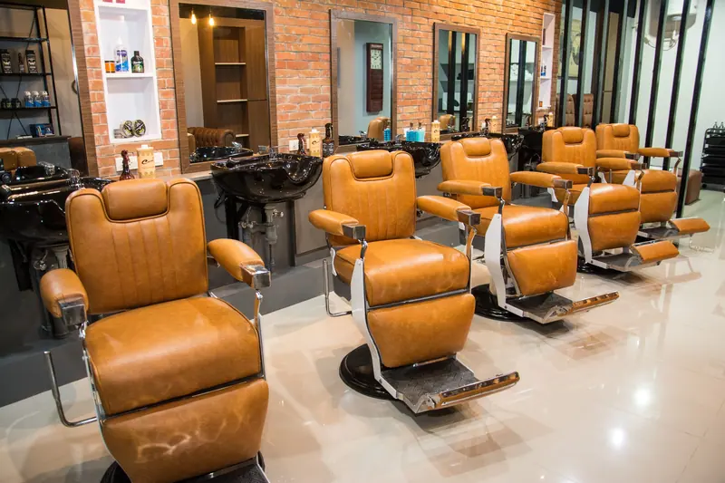 Tan leather barber chairs in a row