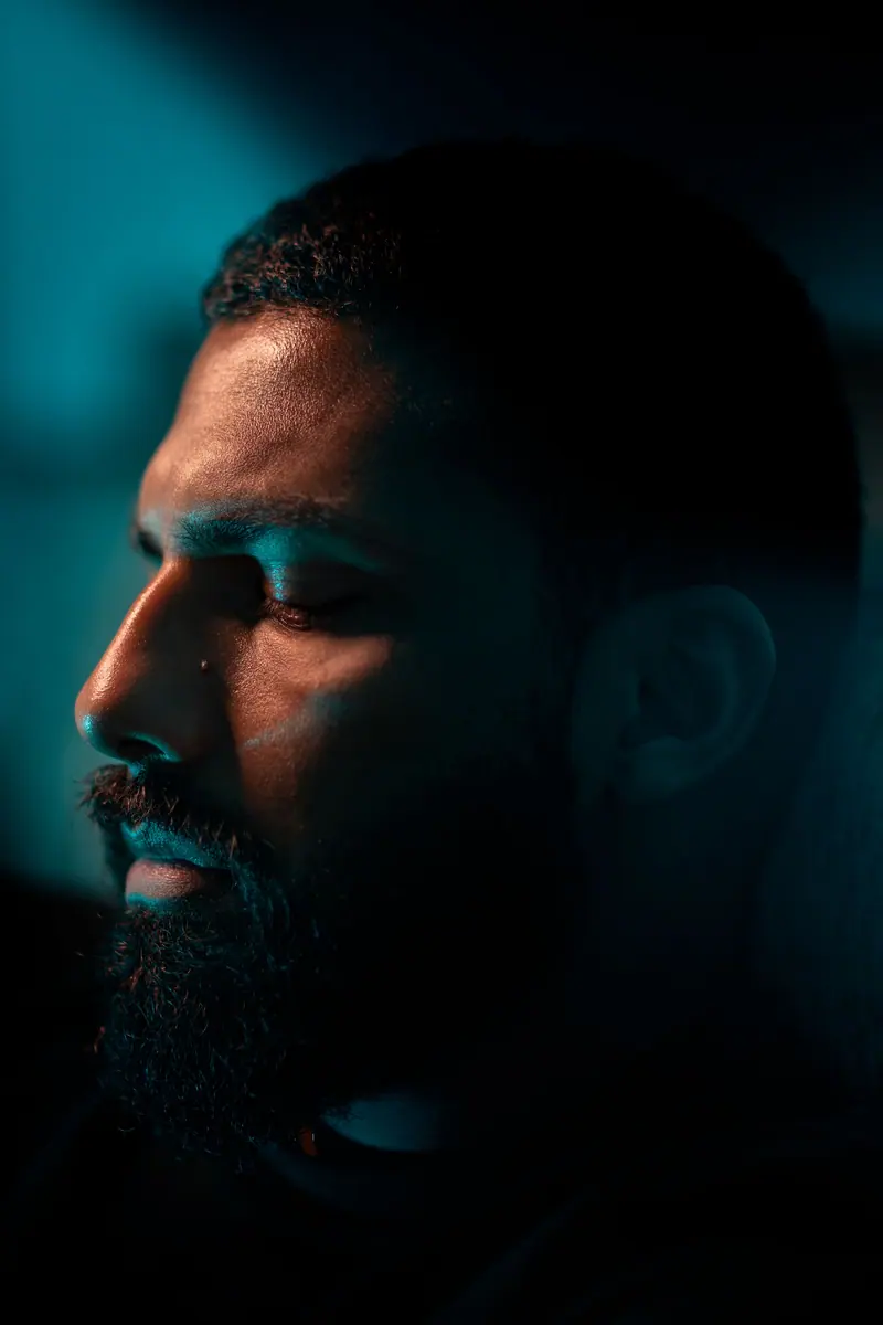 Moody profile in teal and amber