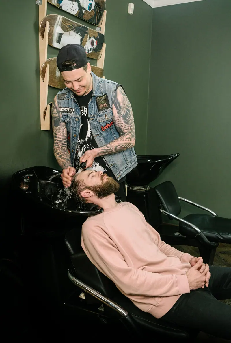 Barber at the shampoo bowl