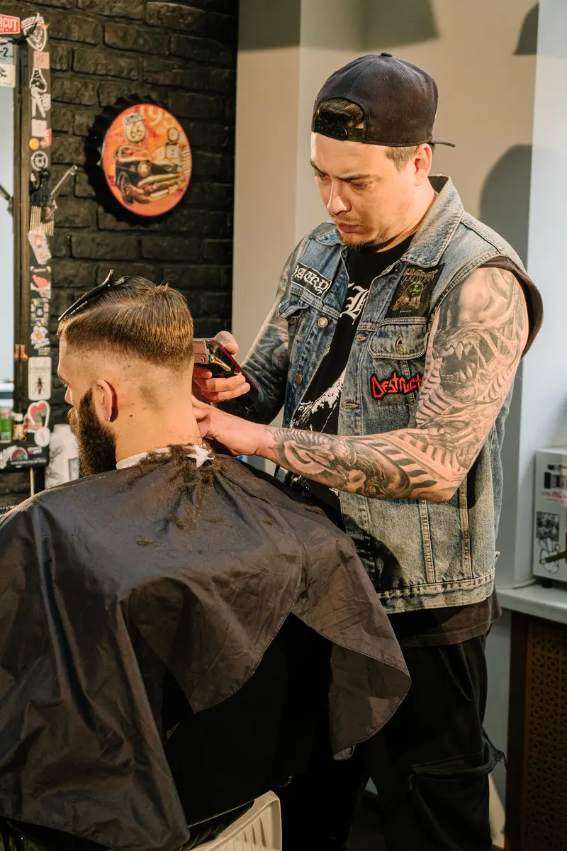 Barber shaping a fade