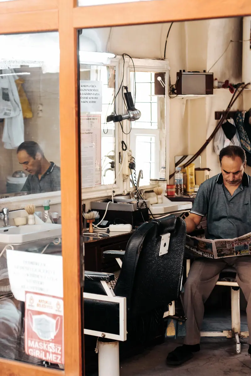 Barber at work by the window