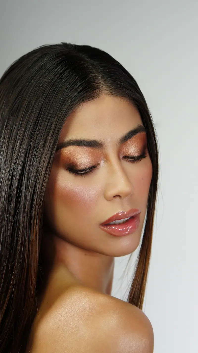 Long straight dark hair over one shoulder