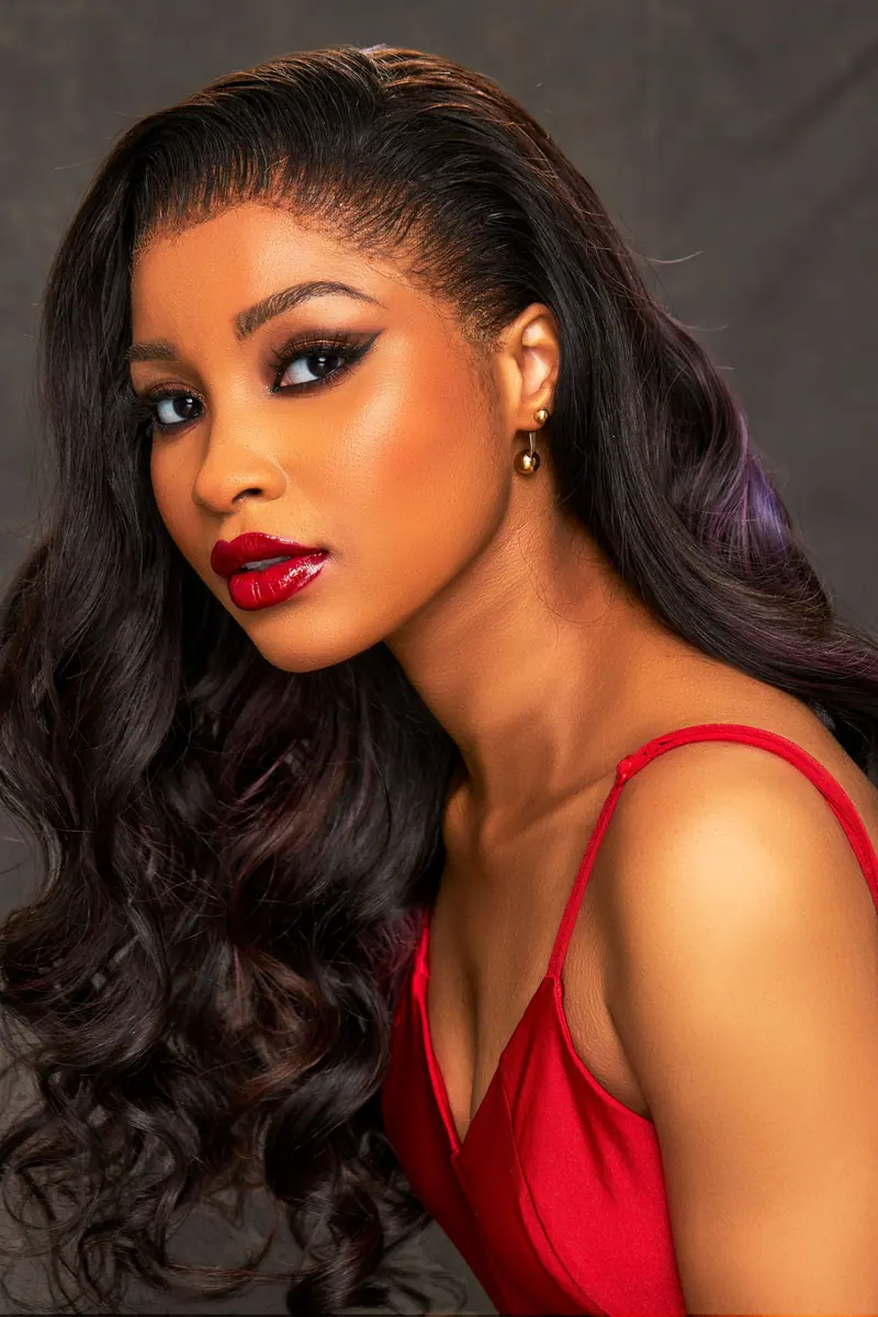 Glossy curled lengths with a red dress