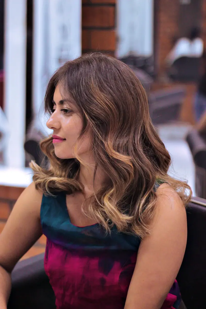 Glossy balayage waves in the salon chair