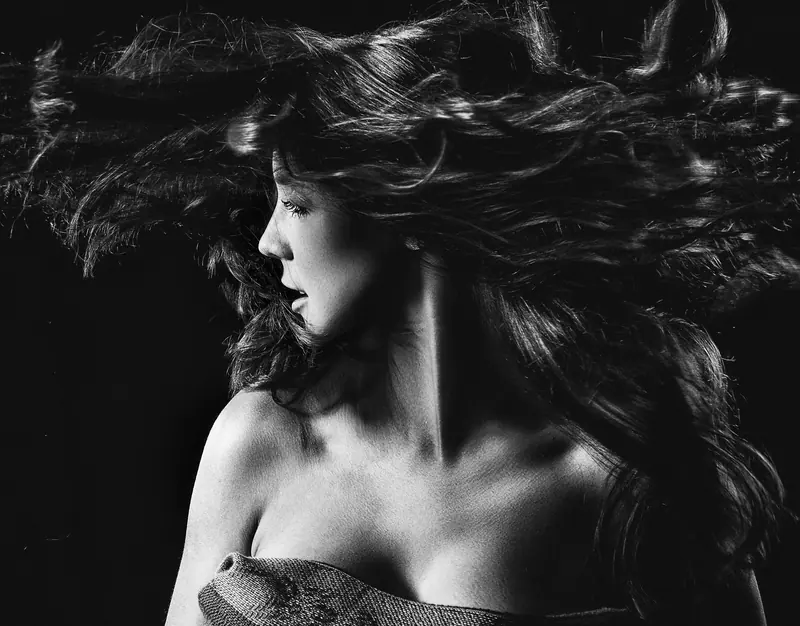 Black-and-white portrait with voluminous hair