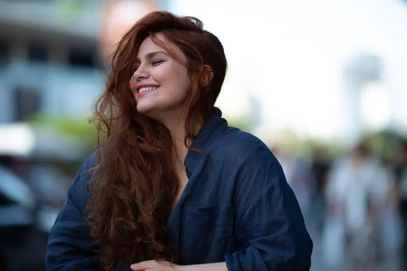 Joyful smile with tousled hair