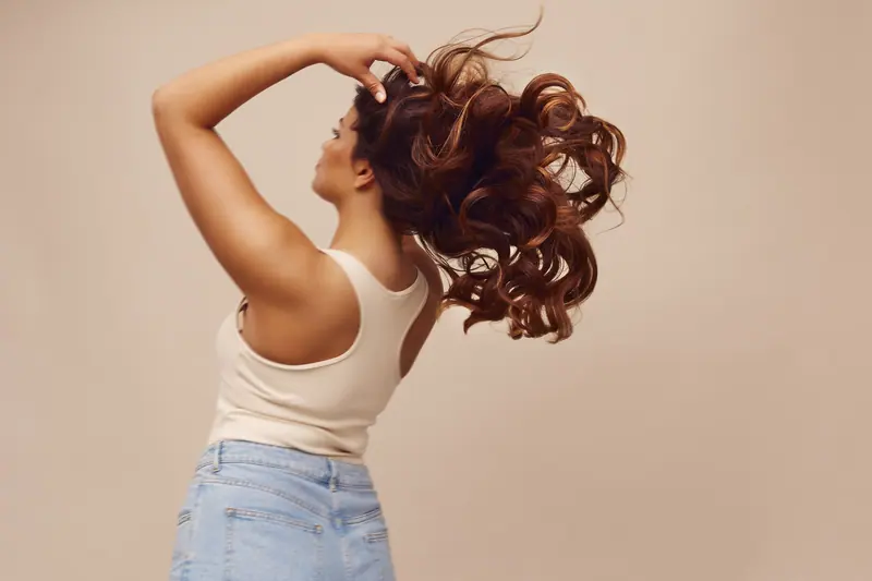 Hair flip in soft studio light