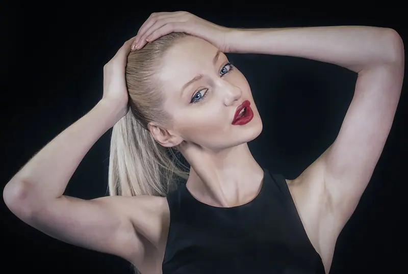 Sleek platinum ponytail in a studio portrait
