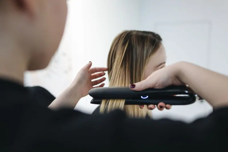 Smoothing with a flat iron at the station