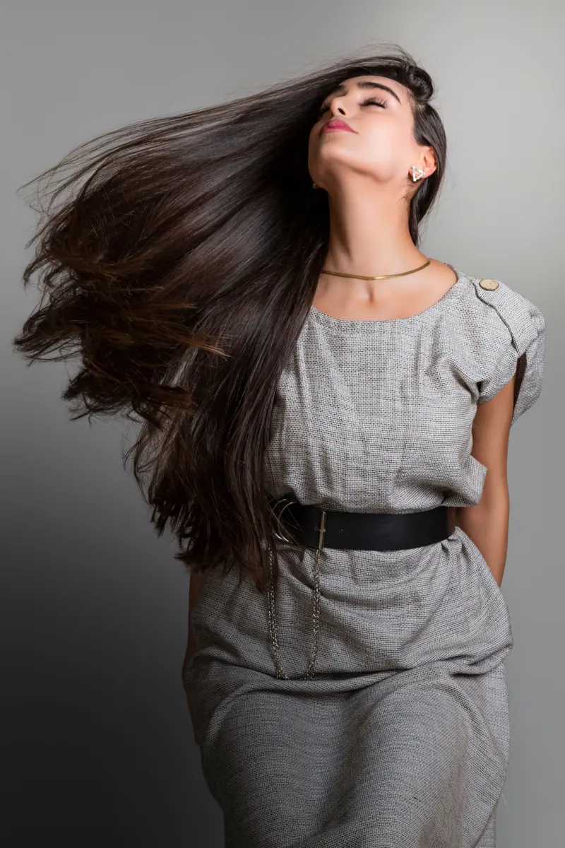 Hair flip in a grey suit
