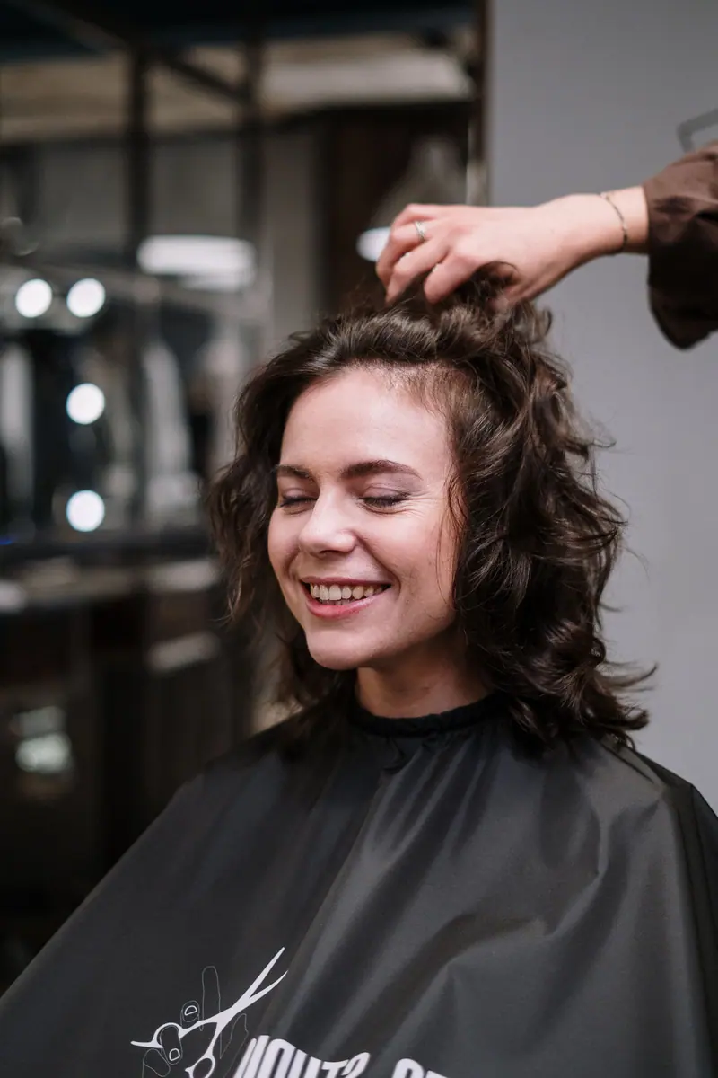 Curly client mid-blowout