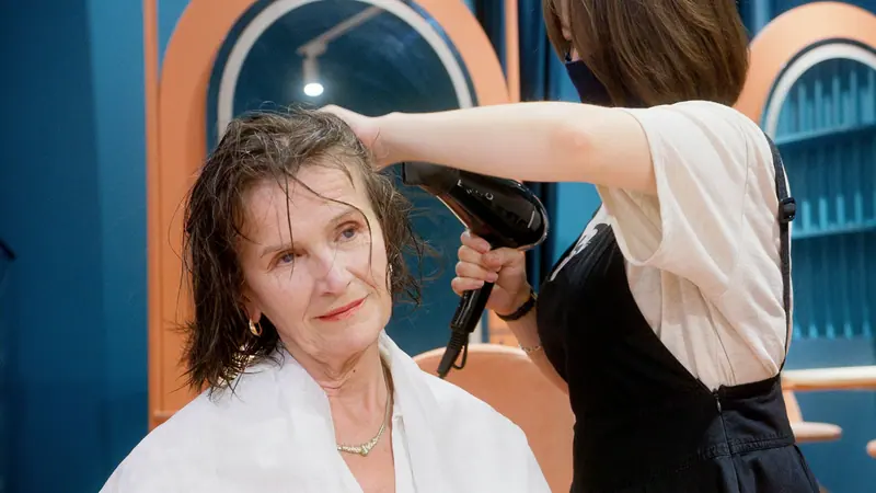 Blow-drying under blue arches