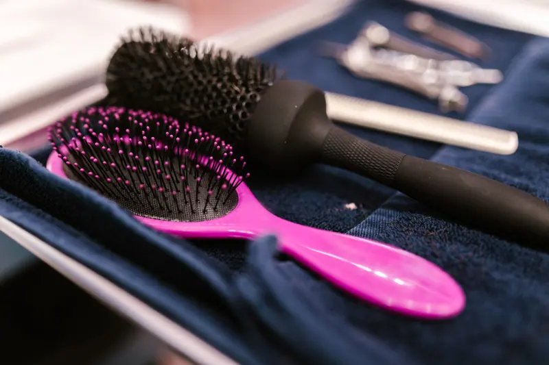 Round and paddle brushes laid out at the station