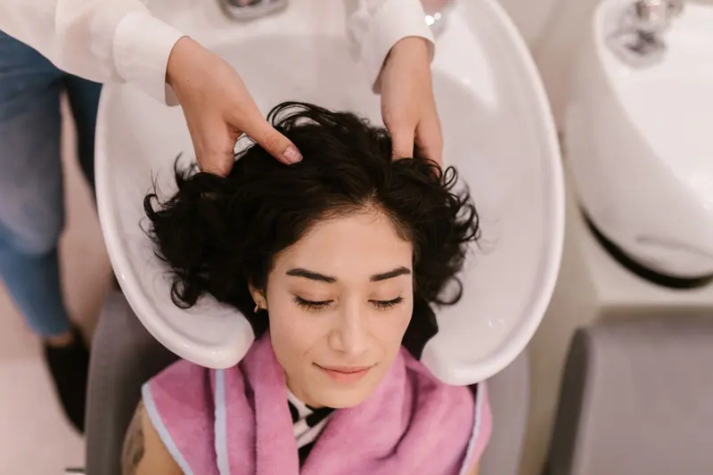 Client relaxing at the shampoo bowl
