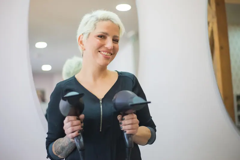 Stylist finishing a blowout in the mirror