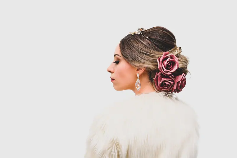 A stylish woman with an intricate rose hairstyle and a fur coat, exuding elegance.