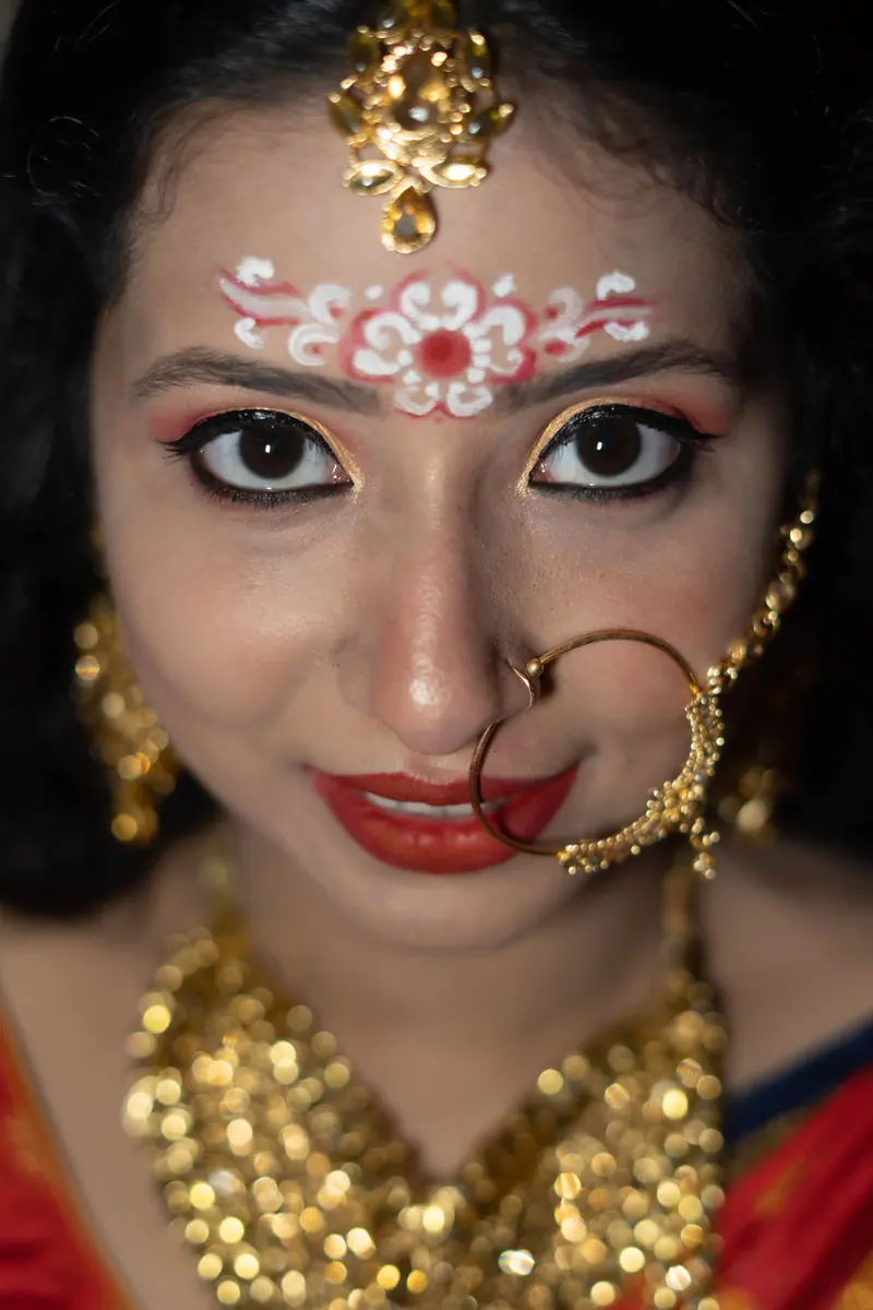 Captivating close-up of an Indian bride with traditional jewelry and makeup