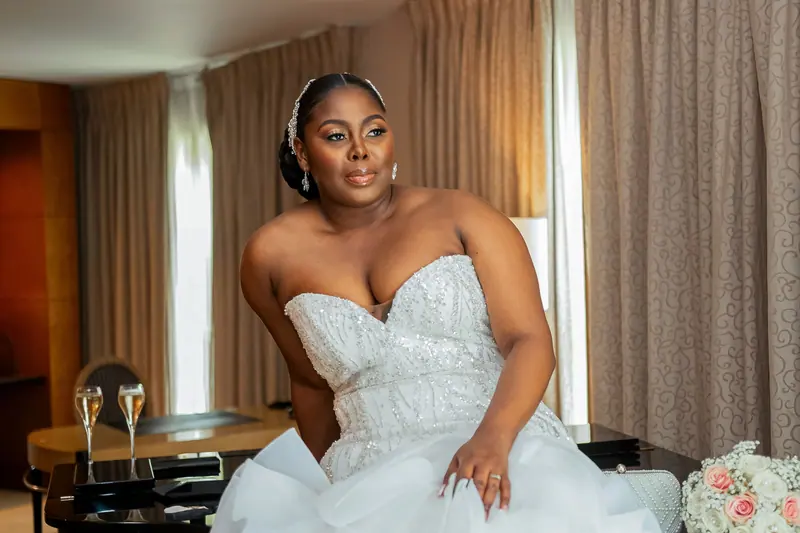 Stunning portrait of a black bride in an elegant wedding dress, exuding grace.
