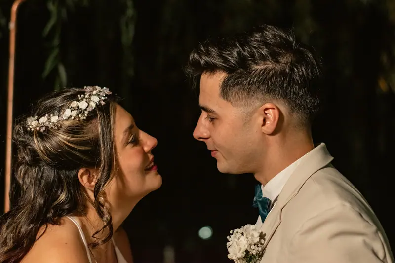 Bride and groom sharing a special moment during their wedding ceremony, capturing a sense of love and joy.
