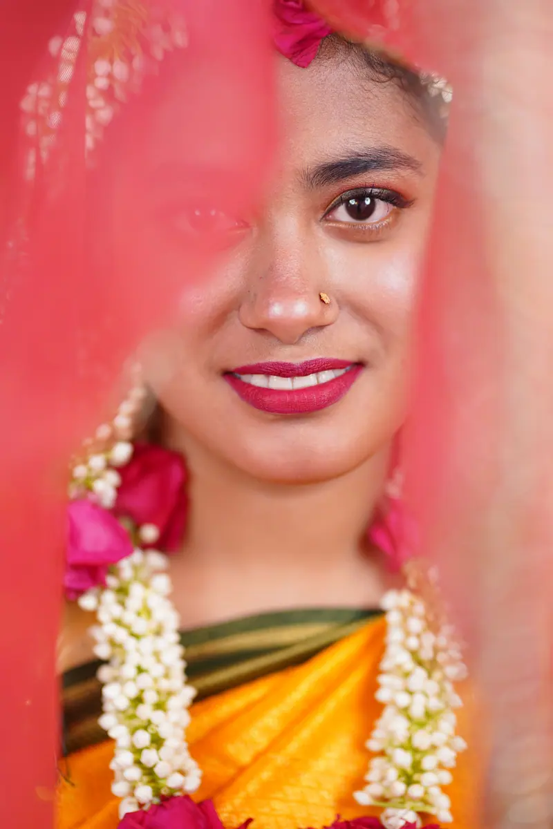 Captivating portrait of a woman in vibrant traditional attire with floral garland. Perfect for cultural themes.