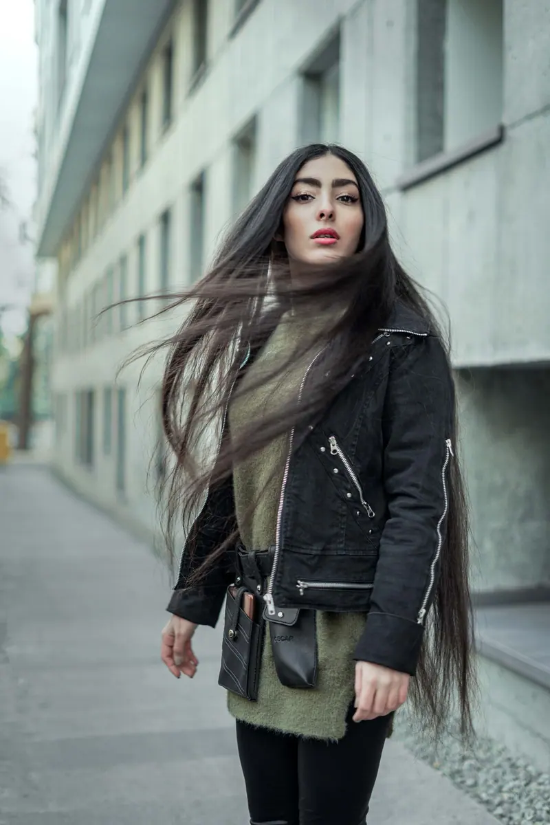 Very long hair on a city street