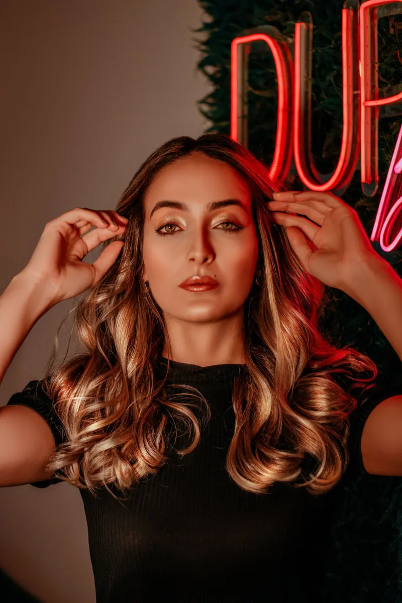 Bronzed waves under neon light