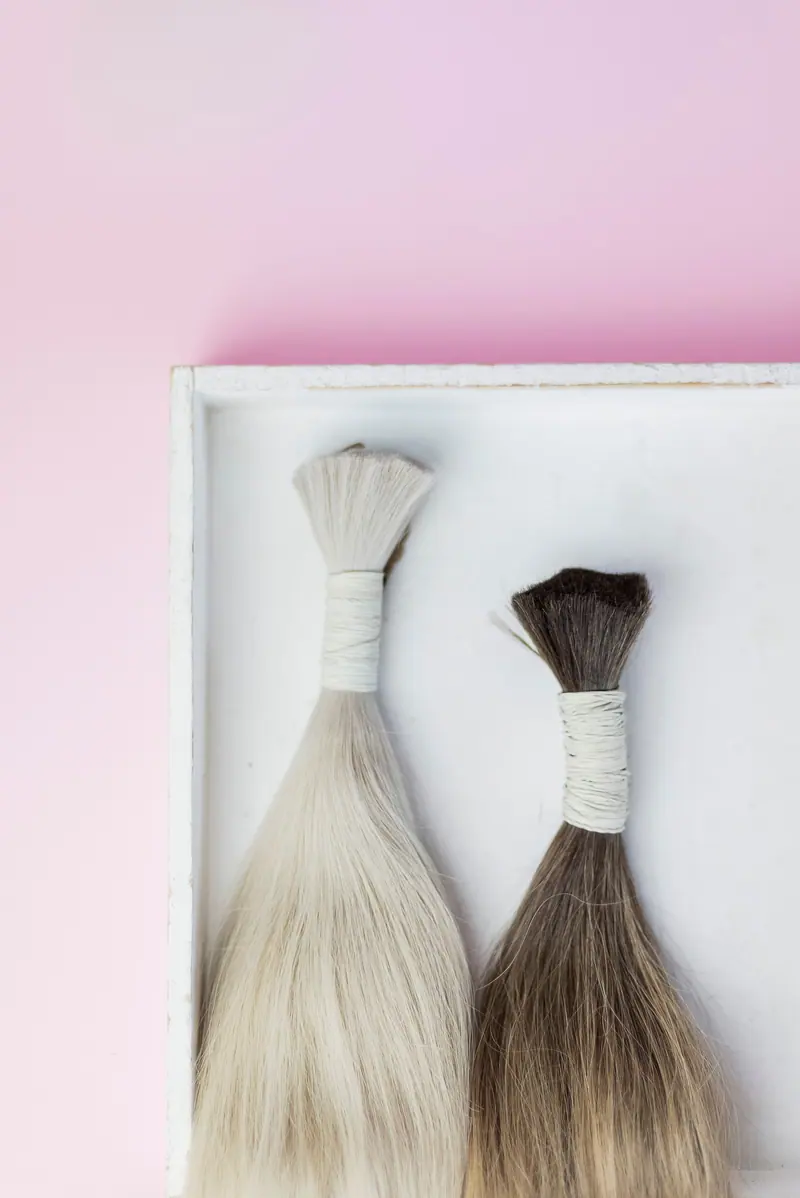Bundles of blonde hair in a white box