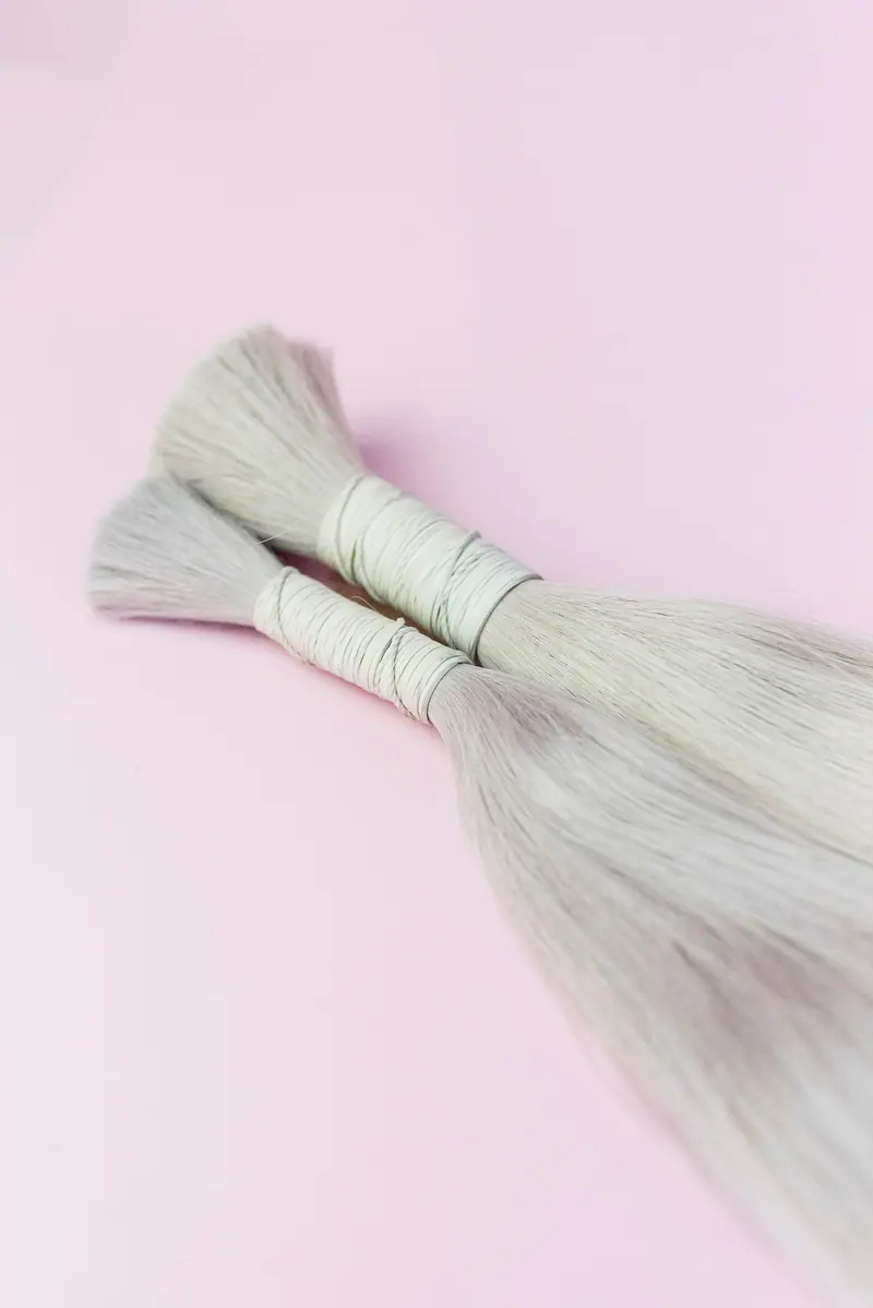 Extension bundle bound with white thread