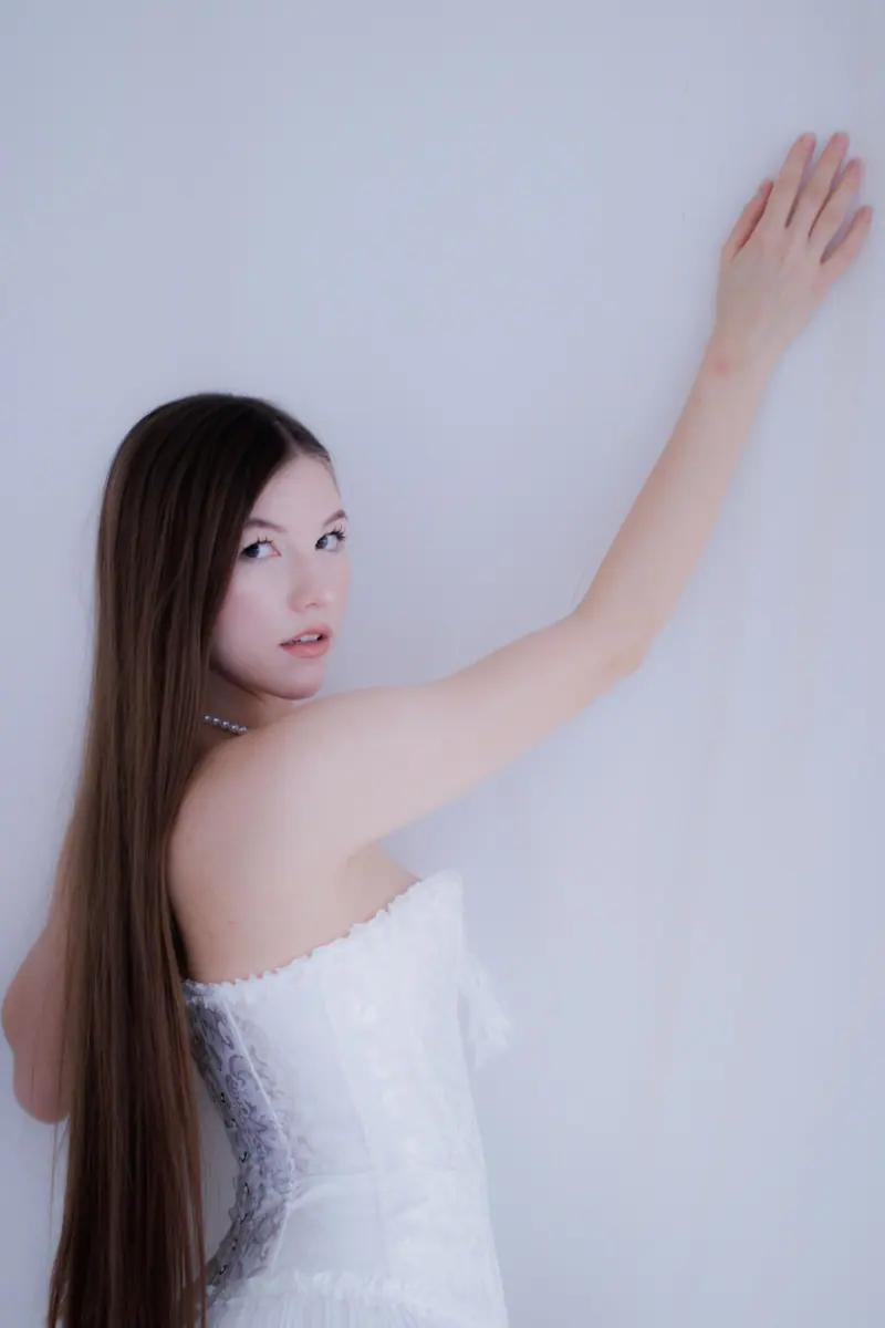 Long dark hair against white