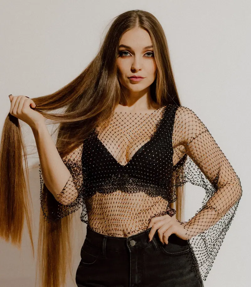 Very long hair against an ivory wall
