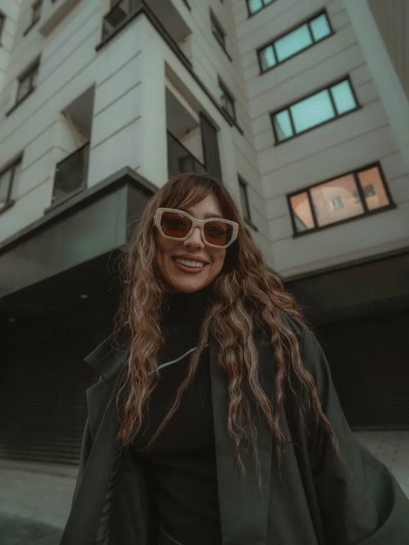 Long hair and sunglasses on a city street