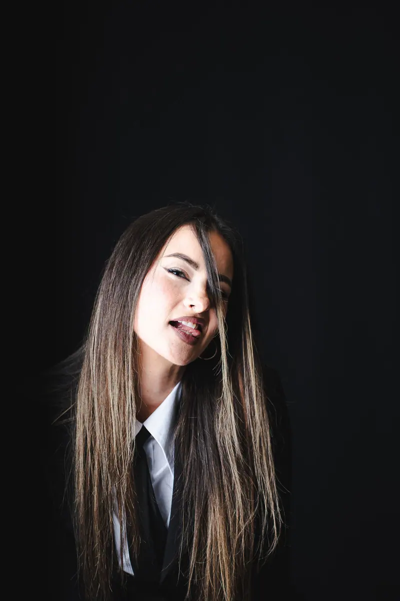 Long straight lengths in a dark studio portrait