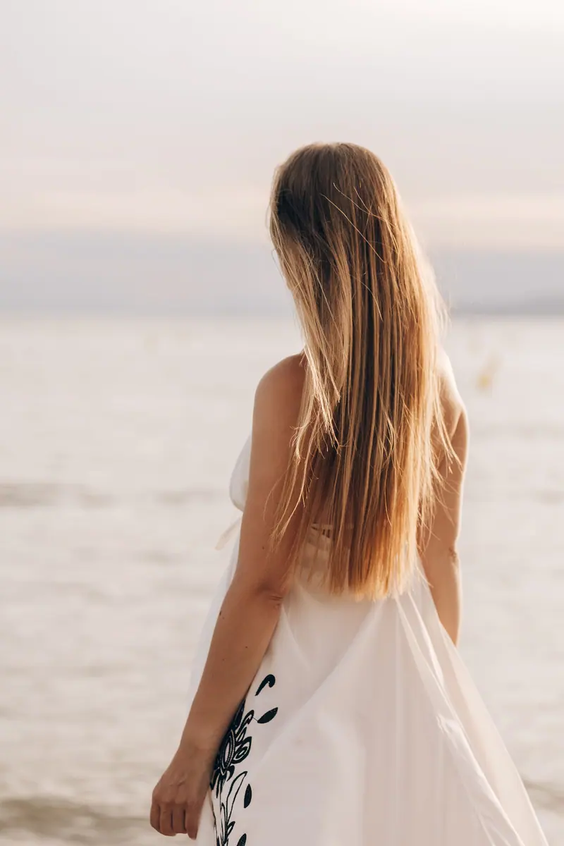 Long blonde hair by the sea