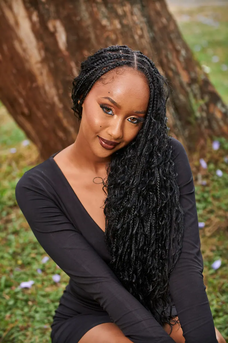 Long braids against greenery