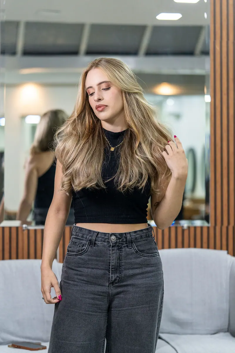 Long blonde waves in a salon