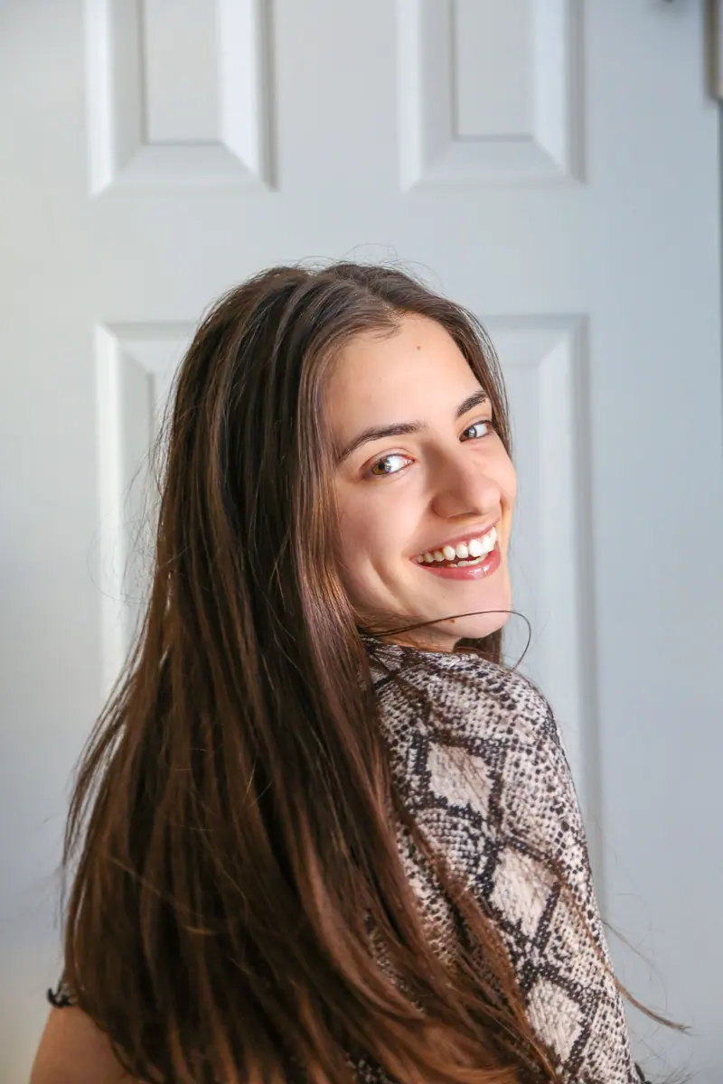 Smiling portrait with long brunette lengths