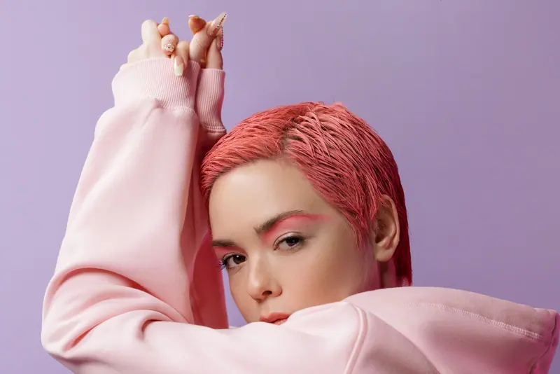 Coral-pink crop against lilac