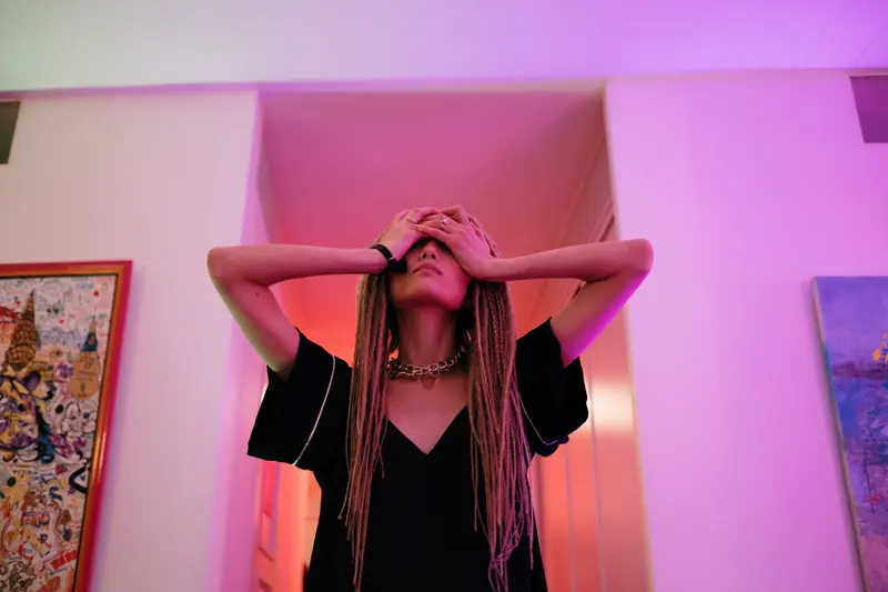 Long braids under violet light